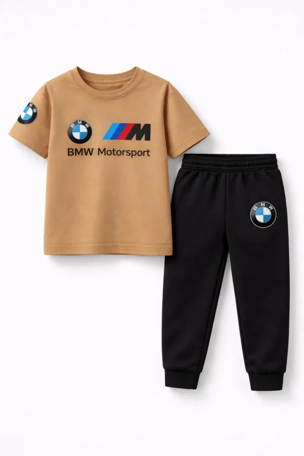 Toddler boy modeling a camel-colored BMW Motorsport short-sleeve t-shirt and black jogger pants tracksuit.